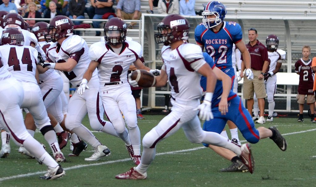 Rocky River quarterback Eric Jones ran for a 35-yard touchdown in the first half of the victory at Bay Friday night. Photo – Ryan Kaczmarski