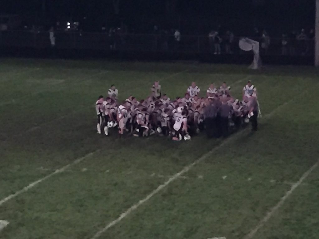 Columbia huddles after the win - Photo by Matt Loede