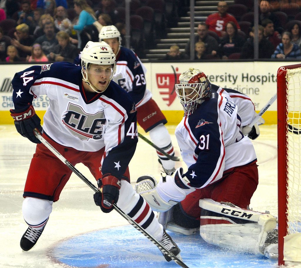 Lake Erie Monsters defenseman Justin Falk covers the back door for goalkeeper Anton Frosberg during the opening night win over the Iowa Wild. Photo by Ryan Kaczmarski