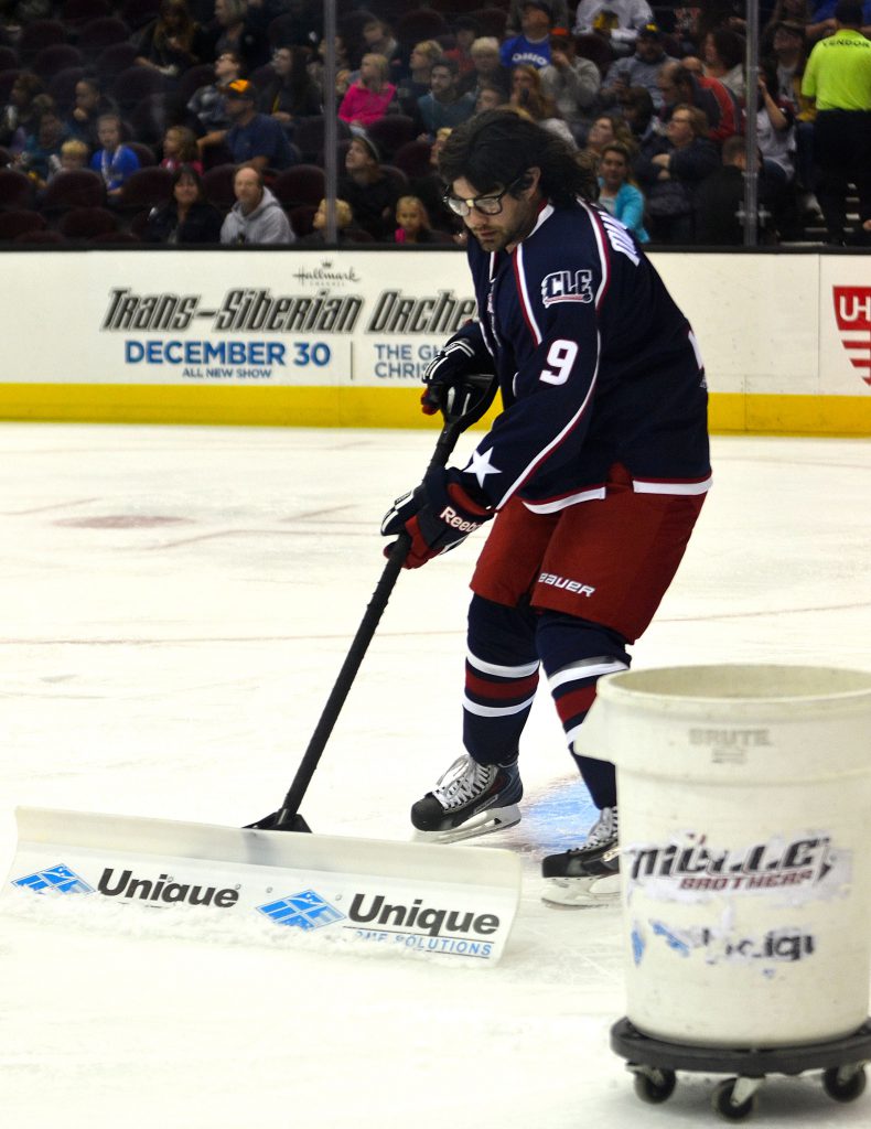 One of the Mullet Brothers cleans the ice during an official's time out. Photo by Ryan Kaczmarski