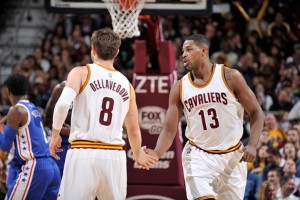 Cavs forward Tristan Thompson shares a moment with guard Matthew Dellavedova.