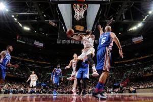 Kyrie Irving hits a reverse layup against Kendall Marshall in the Cavs win in his return to action after over six months on the injured list.