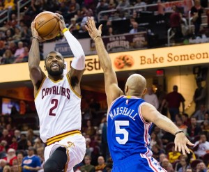 Kyrie Irving shoots over Philadelphia guard Kendall Marshall during the third quarter of the Cavaliers' 108-86 win at Quicken Loans Arena.
