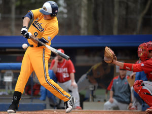 Sophomore infielder Zarley Zalewski makes contact with a pitch at the game against Miami University.