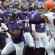 Dec 28, 2014; Baltimore, MD, USA; Baltimore Ravens running back Justin Forsett (29) runs past Cleveland Browns outside linebacker Paul Kruger (99) during the first quarter at M&T Bank Stadium. Mandatory Credit: Tommy Gilligan-USA TODAY Sports