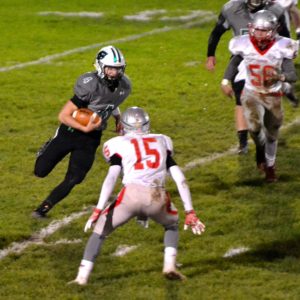 Columbia quarterback Cody Schwartz used his legs and his arm to move to ball Friday night. Photo – Ryan Kaczmarski