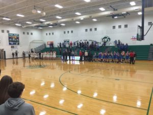 The Rockets and the Green Wave stand while awaiting the National Anthem. 